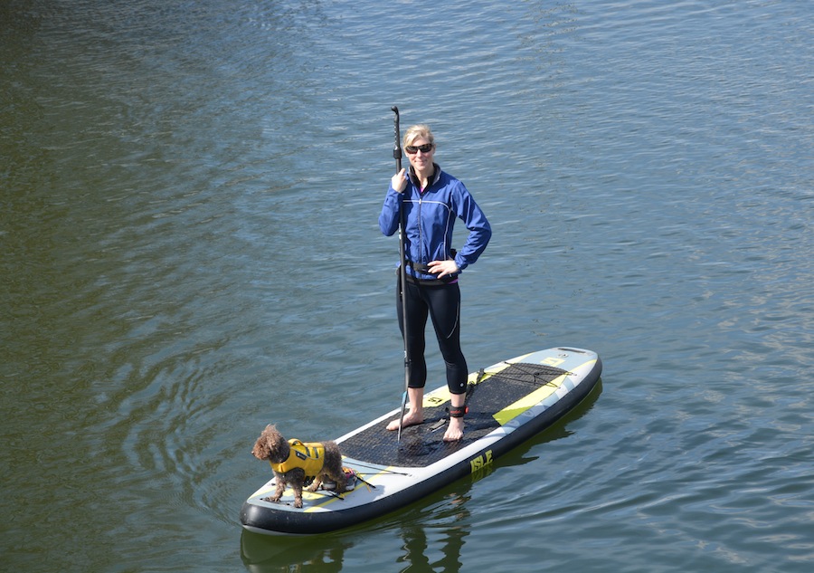 standing on inflatable stand up paddle board