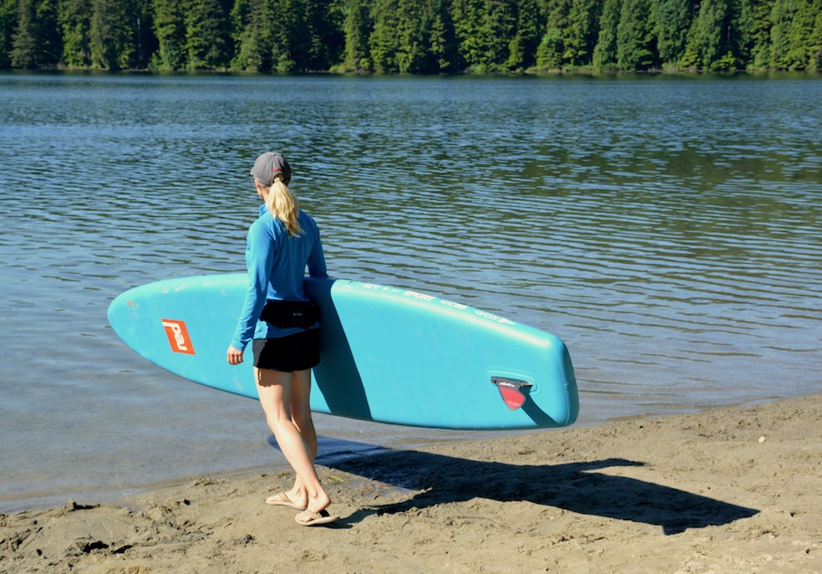 carrying the Red Paddle Co Sport inflatable SUP