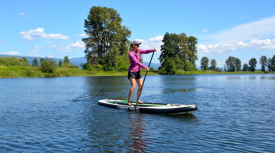stand-up paddling on the current drives Huey ISUP