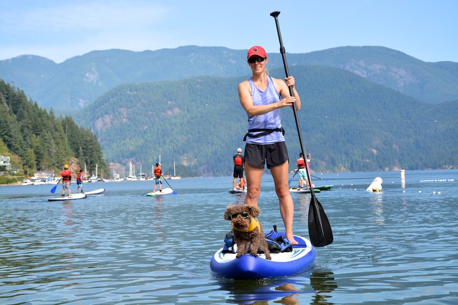 Doggles paddle boarding with dog