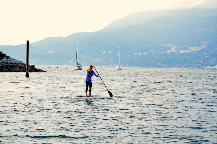 stand up paddling along Kits Beach Vancouver