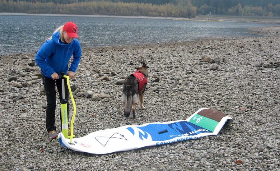 inflating Earth River SUP with hand pump