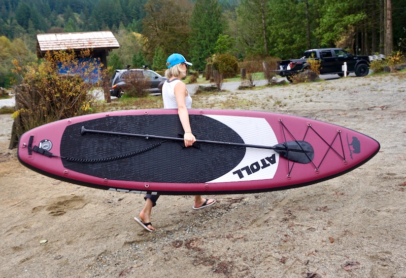 carrying the 11' Atoll paddle board to the water