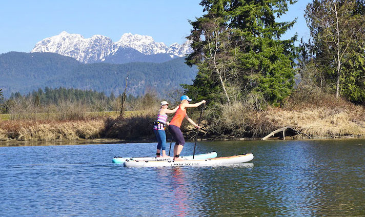 paddle boarding with a friend