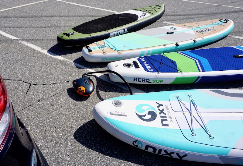 inflating four paddle boards with the Shark electric pump