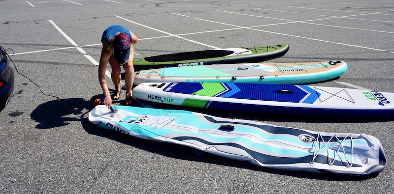 inflating four paddle boards with the Shark II high-pressure electric pump