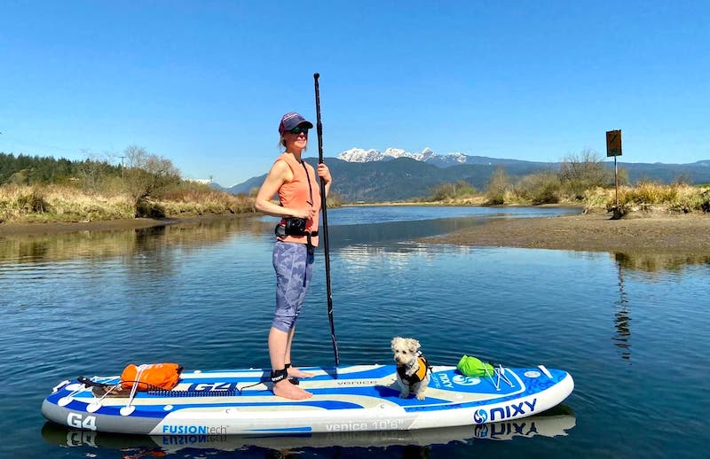 stand up paddle boarding on the NIXY Venice G4 inflatable SUP with my dog