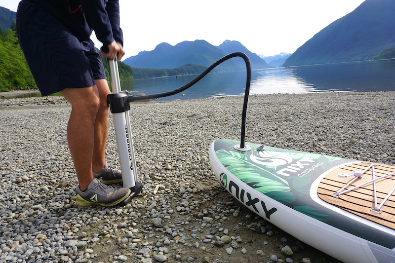 inflating the Nixy paddle board with the Typhoon pump
