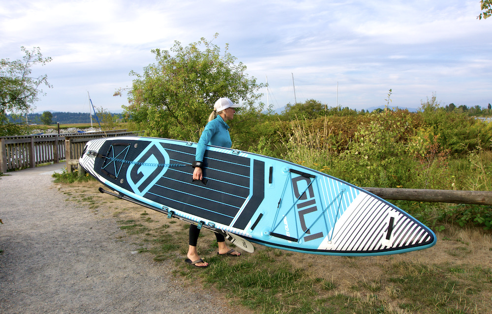 carrying the Gili Touring Paddle board