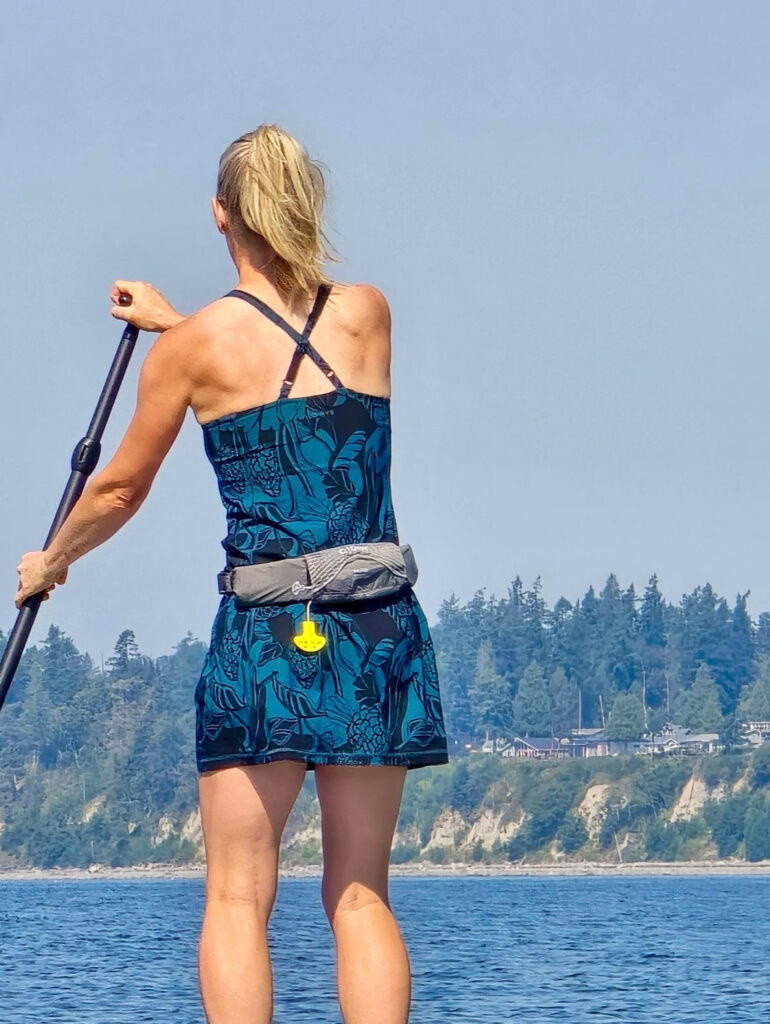 paddleboarding wearing the Parker Action Dress